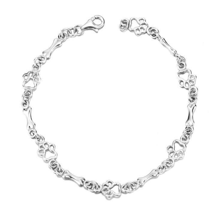 Armband mit hängenden Hundepfoten und Knochen aus Weissgold, Limitierte Auflage