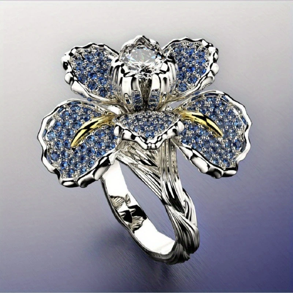 Weissgoldring mit blauen Blüten und Kristall