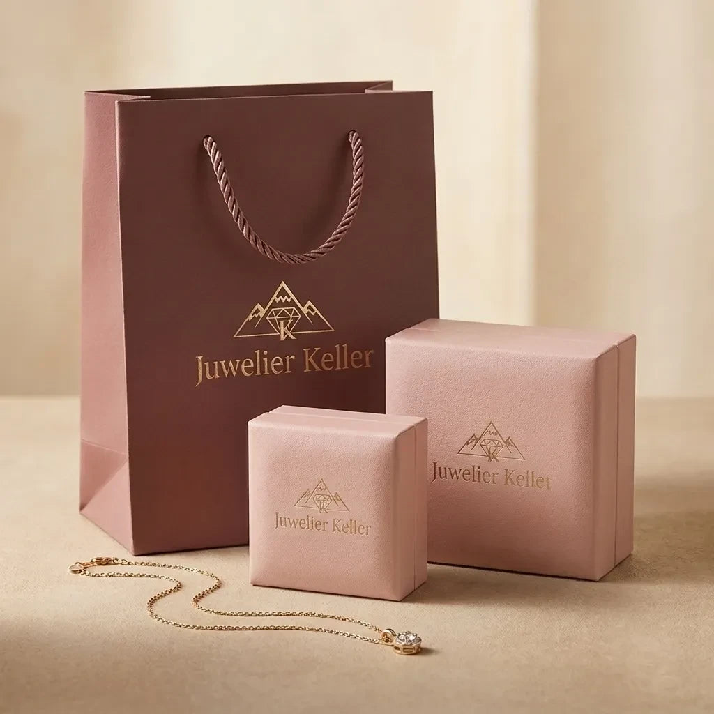 Embalagem de presente Juwelier Keller com saco e caixas cor-de-rosa e um colar de ouro delicado